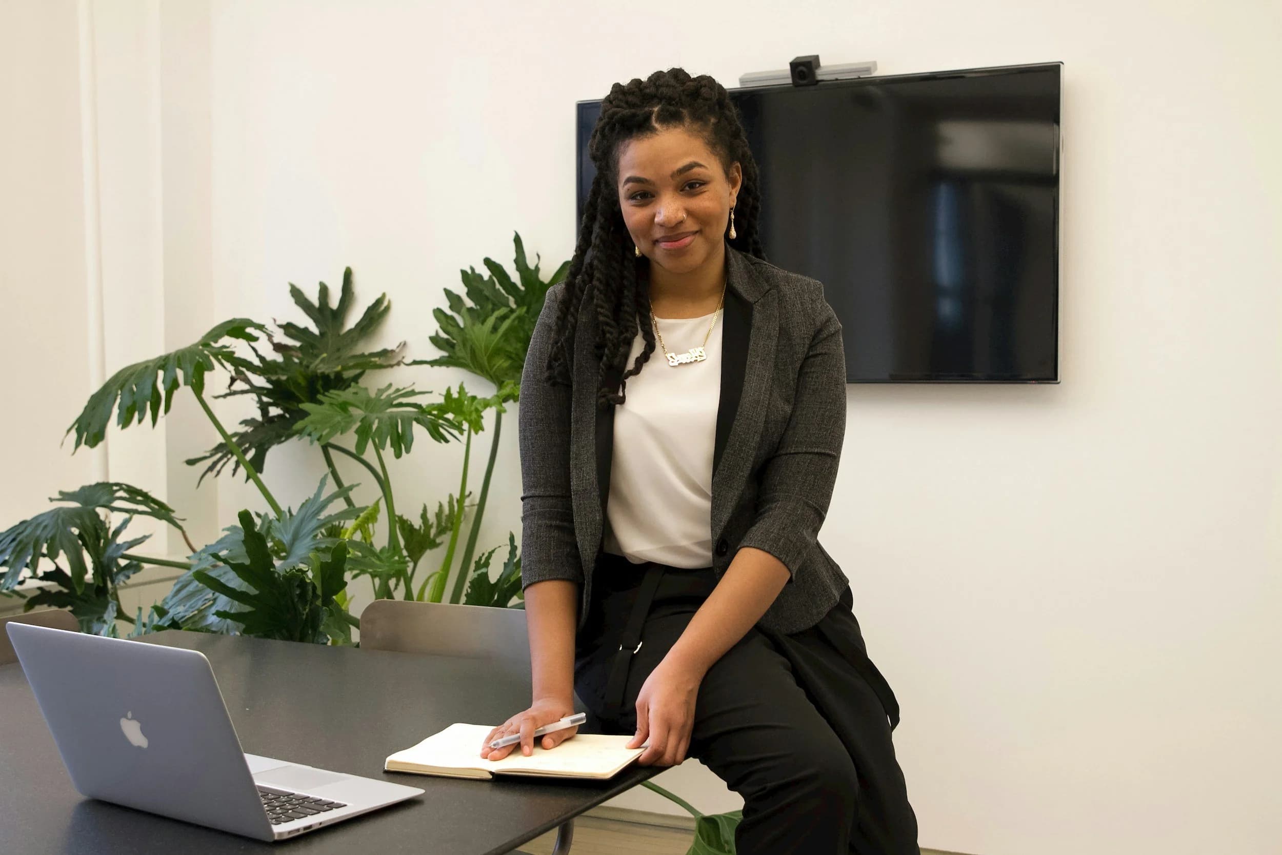 A professional in a bright office, ready to start her new life in Germany